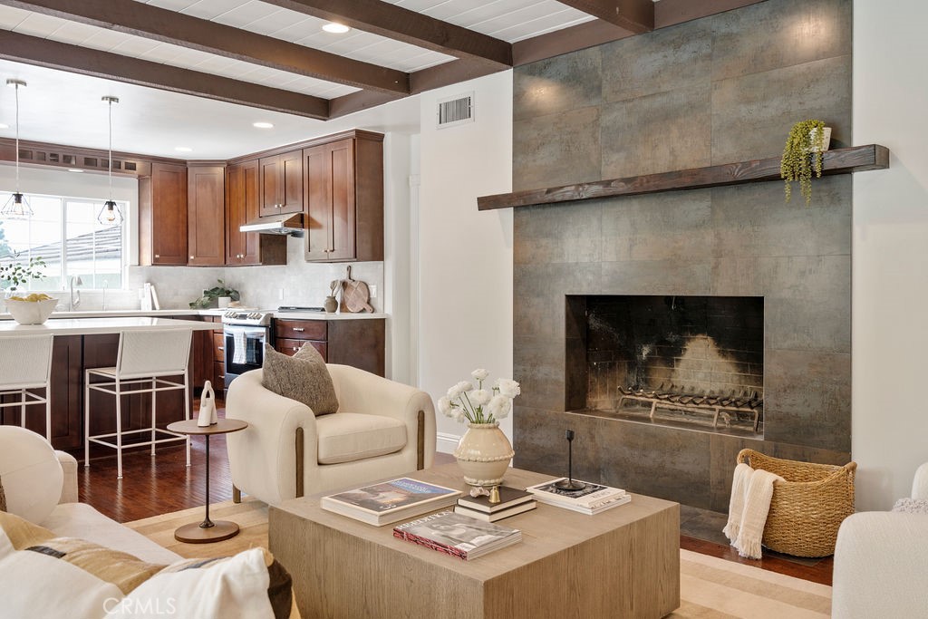 840 Rainbow Drive Glendora, CA 91741 - Photo 18 of 74 a living room with furniture a fireplace and a table
