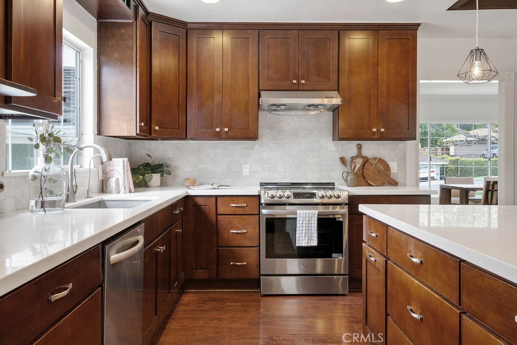 840 Rainbow Drive Glendora, CA 91741 - Photo 25 of 74 a kitchen with stainless steel appliances granite countertop a sink stove and cabinets