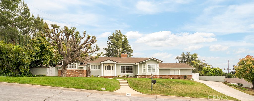 840 Rainbow Drive Glendora, CA 91741 - Photo 3 of 74 a view of a white house with a big yard and potted plants