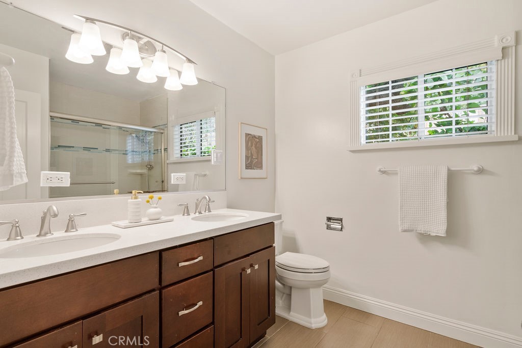 840 Rainbow Drive Glendora, CA 91741 - Photo 37 of 74 a bathroom with a sink a toilet and a mirror
