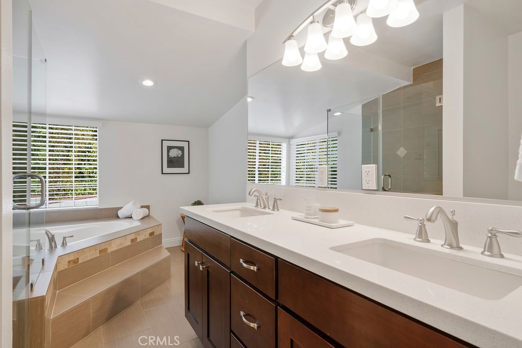 840 Rainbow Drive Glendora, CA 91741 - Photo 45 of 74 a spacious bathroom with a granite countertop double vanity sink a mirror and a bathtub