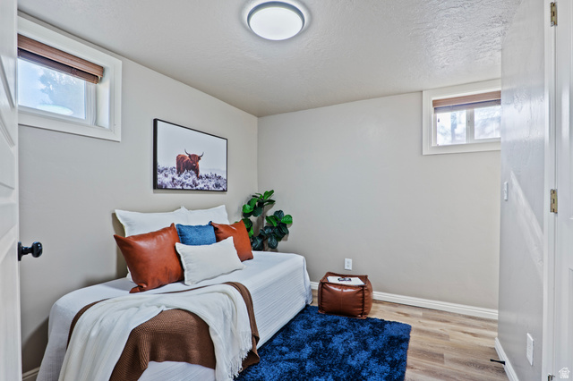 115 East 1600th Street North Santaquin, UT 84655 - Photo 26 of 52 Interior room featuring light-toned walls, wood-finish flooring, and white trim