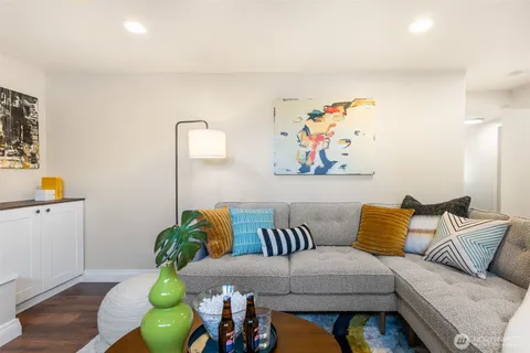 a living room with furniture and flowers