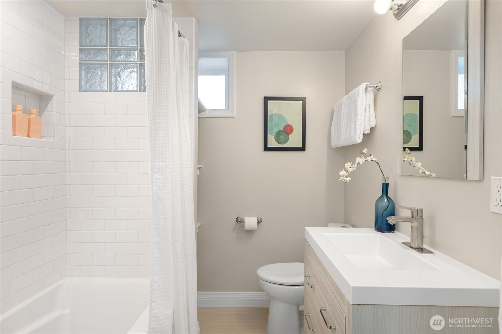 8254 Bagley Avenue North Seattle, WA 98103 - Photo 19 of 21 a bathroom with a sink toilet and shower