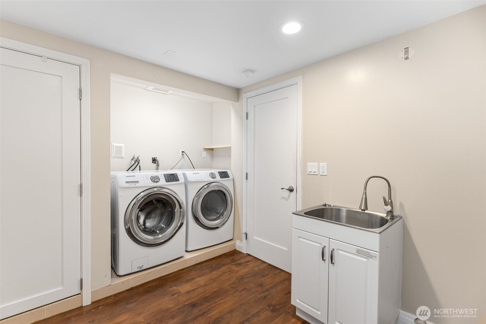 8254 Bagley Avenue North Seattle, WA 98103 - Photo 20 of 21 a utility room with sink dryer and washer