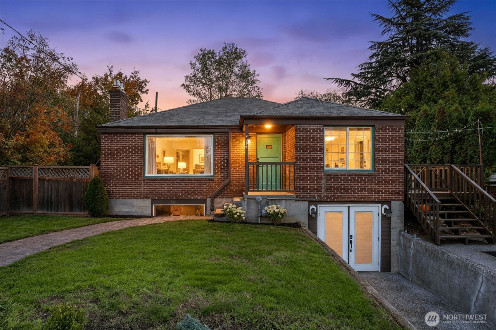 8254 Bagley Avenue North Seattle, WA 98103 - Photo 2 of 21 a front view of a house with garden and sitting area