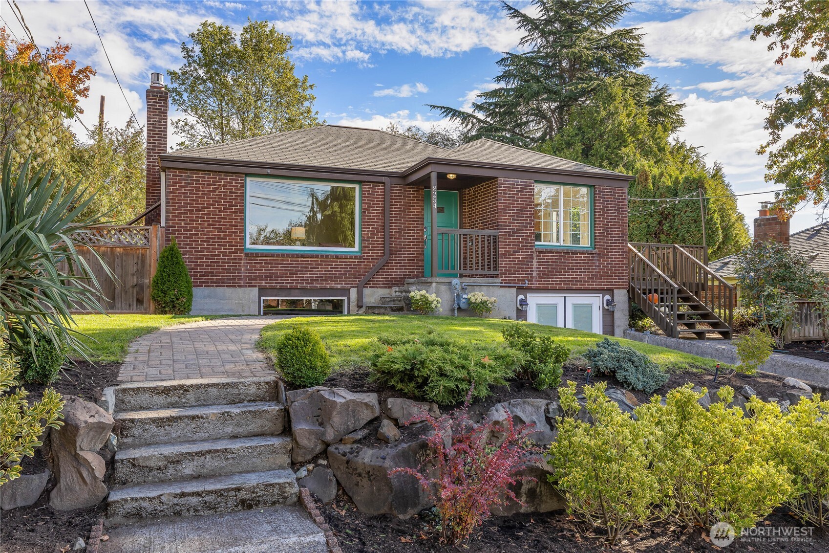 8254 Bagley Avenue North Seattle, WA 98103 - Photo 5 of 21 a front view of a house with a yard and outdoor seating