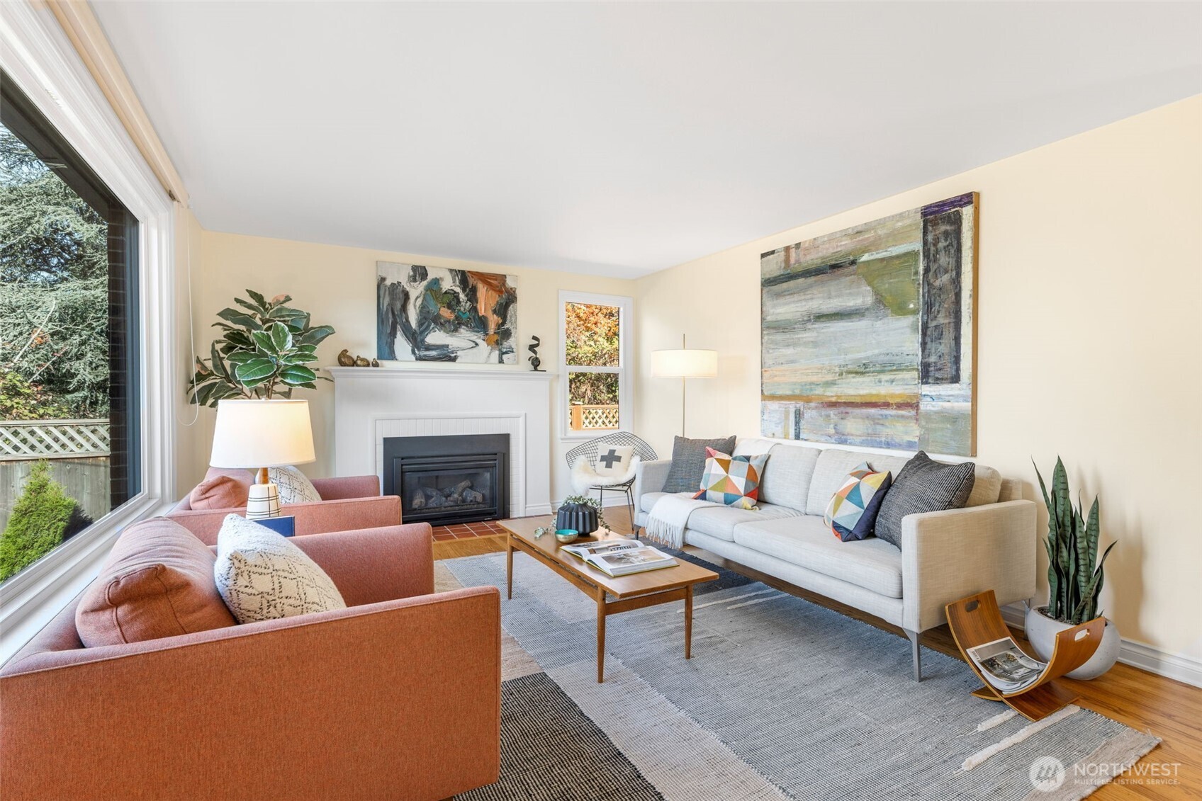8254 Bagley Avenue North Seattle, WA 98103 - Photo 6 of 21 a living room with furniture a rug and a fireplace
