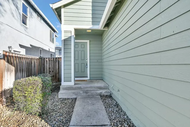 a view of wooden floor and windows in an empty room