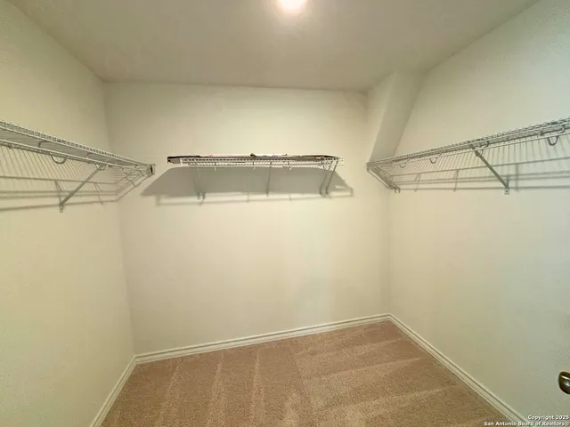 a view of a room with racks on the wall