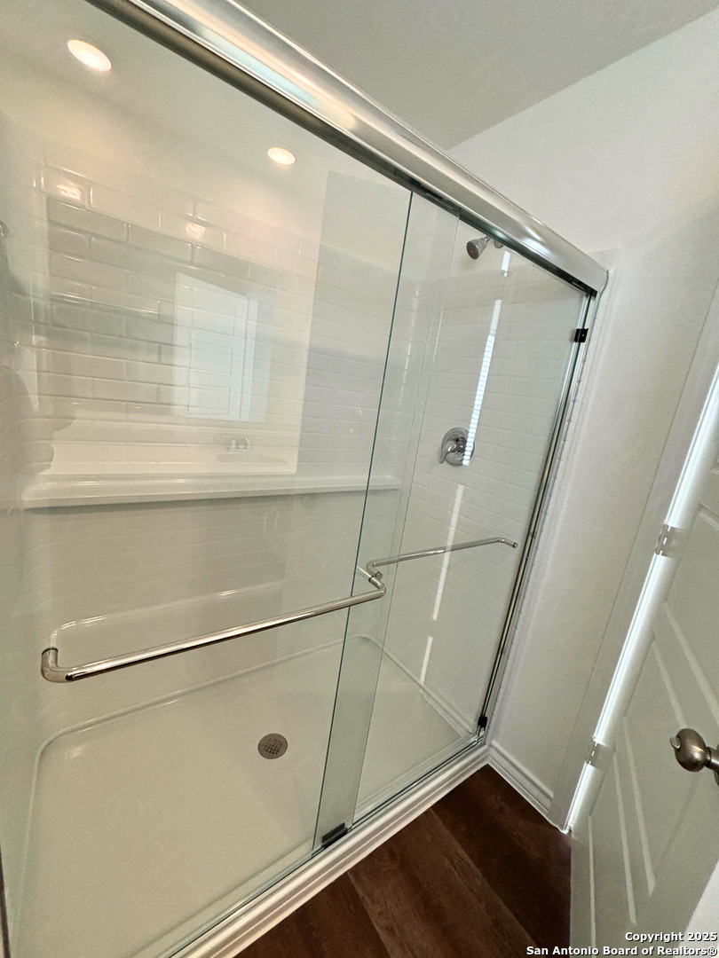 1032 Oriole Way Marion, TX 78124 - Photo 10 of 18 a bathroom with a shower and a glass door