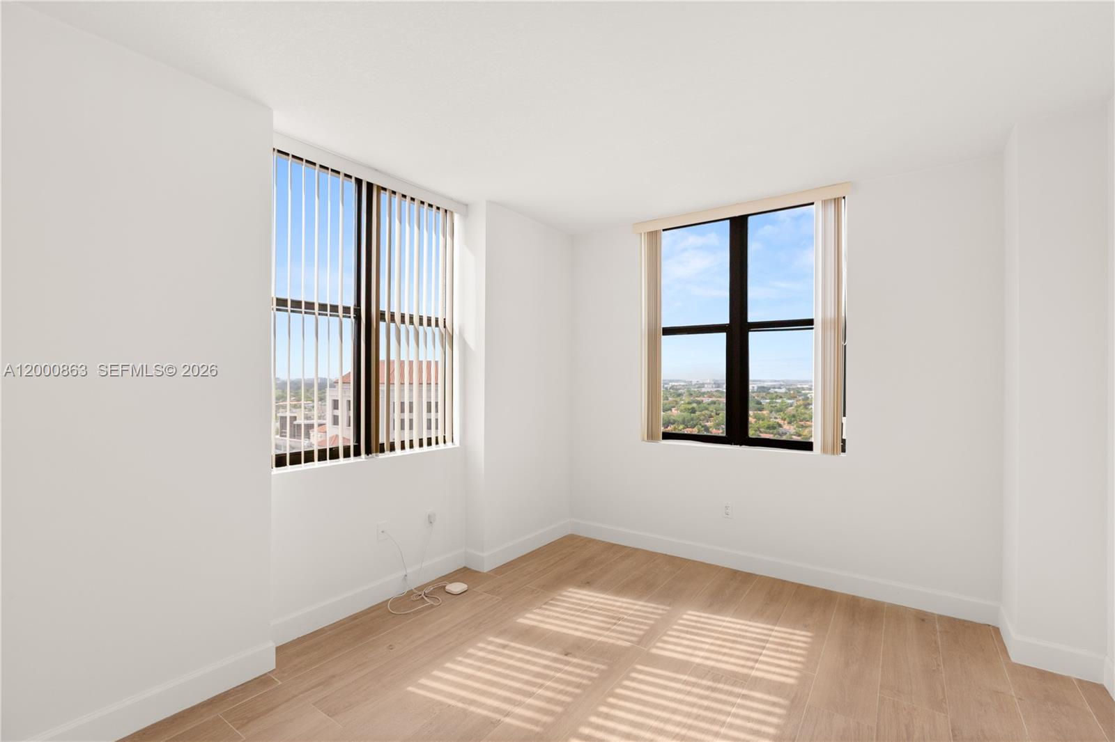888 Douglas Road, Unit PH01 Coral Gables, FL 33134 - Photo 14 of 31 a view of an empty room with a window