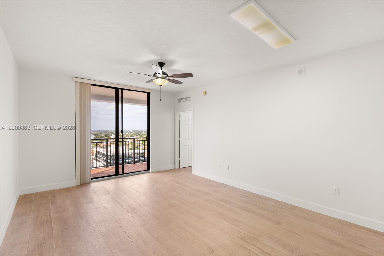 888 Douglas Road, Unit PH01 Coral Gables, FL 33134 - Photo 17 of 31 a view of an empty room with a window