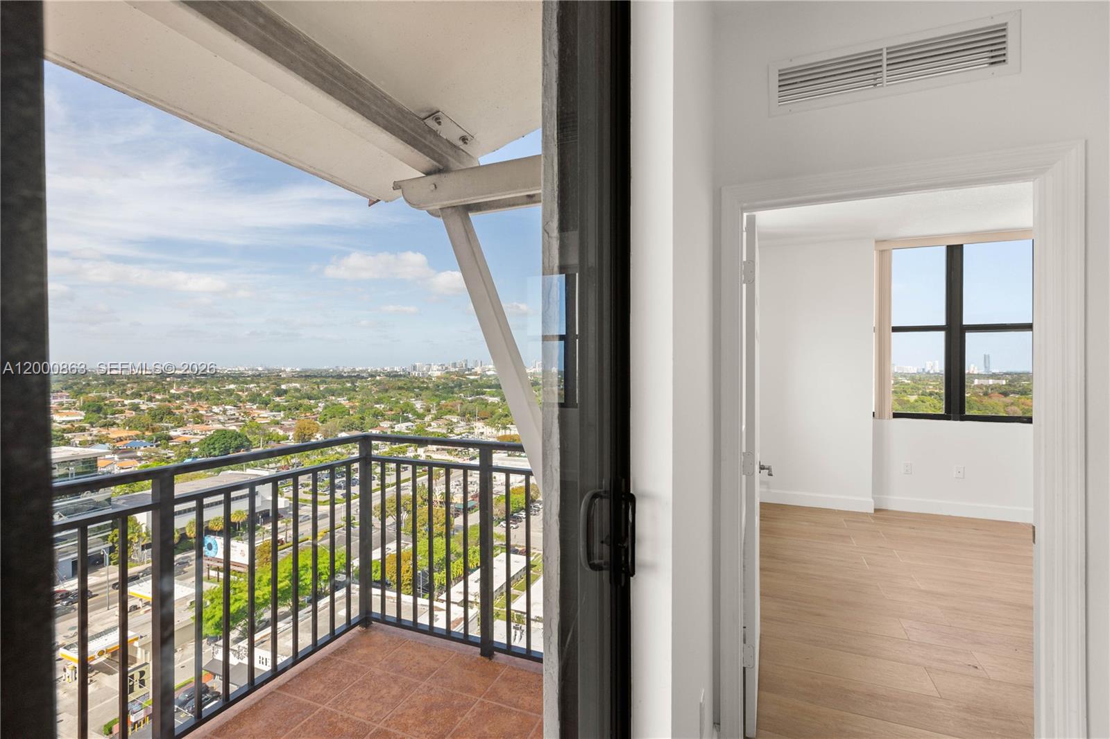 888 Douglas Road, Unit PH01 Coral Gables, FL 33134 - Photo 19 of 31 a view of a balcony with an ocean view
