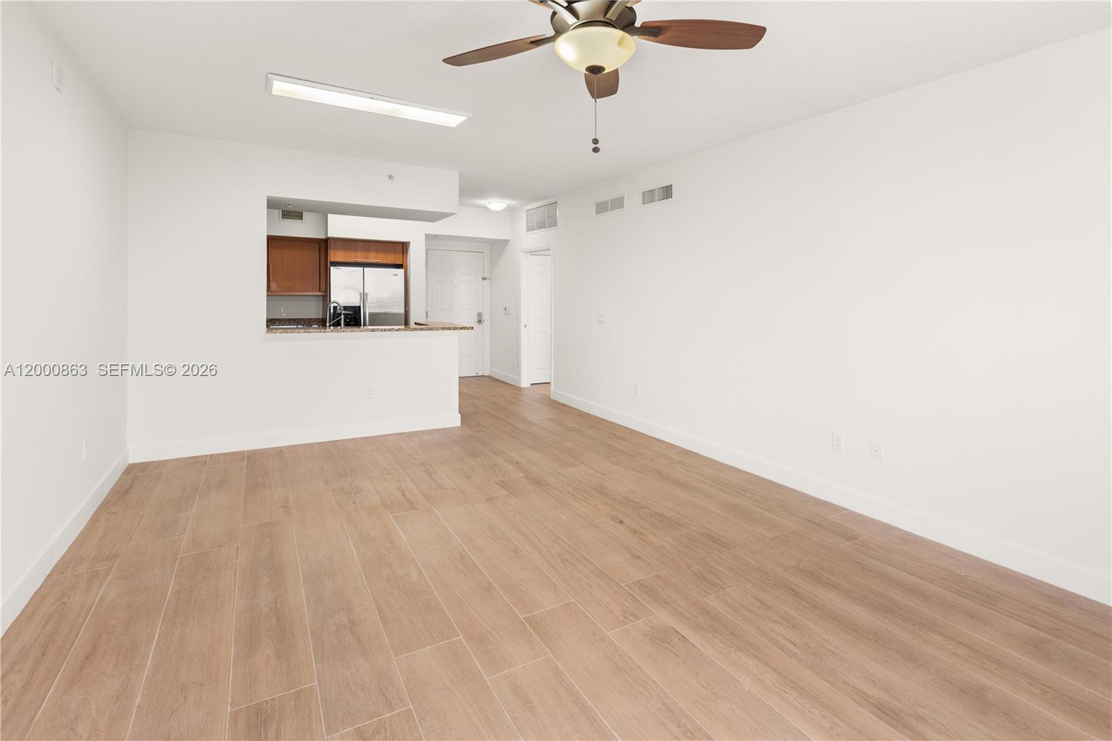 888 Douglas Road, Unit PH01 Coral Gables, FL 33134 - Photo 20 of 31 a view of empty room with wooden floor
