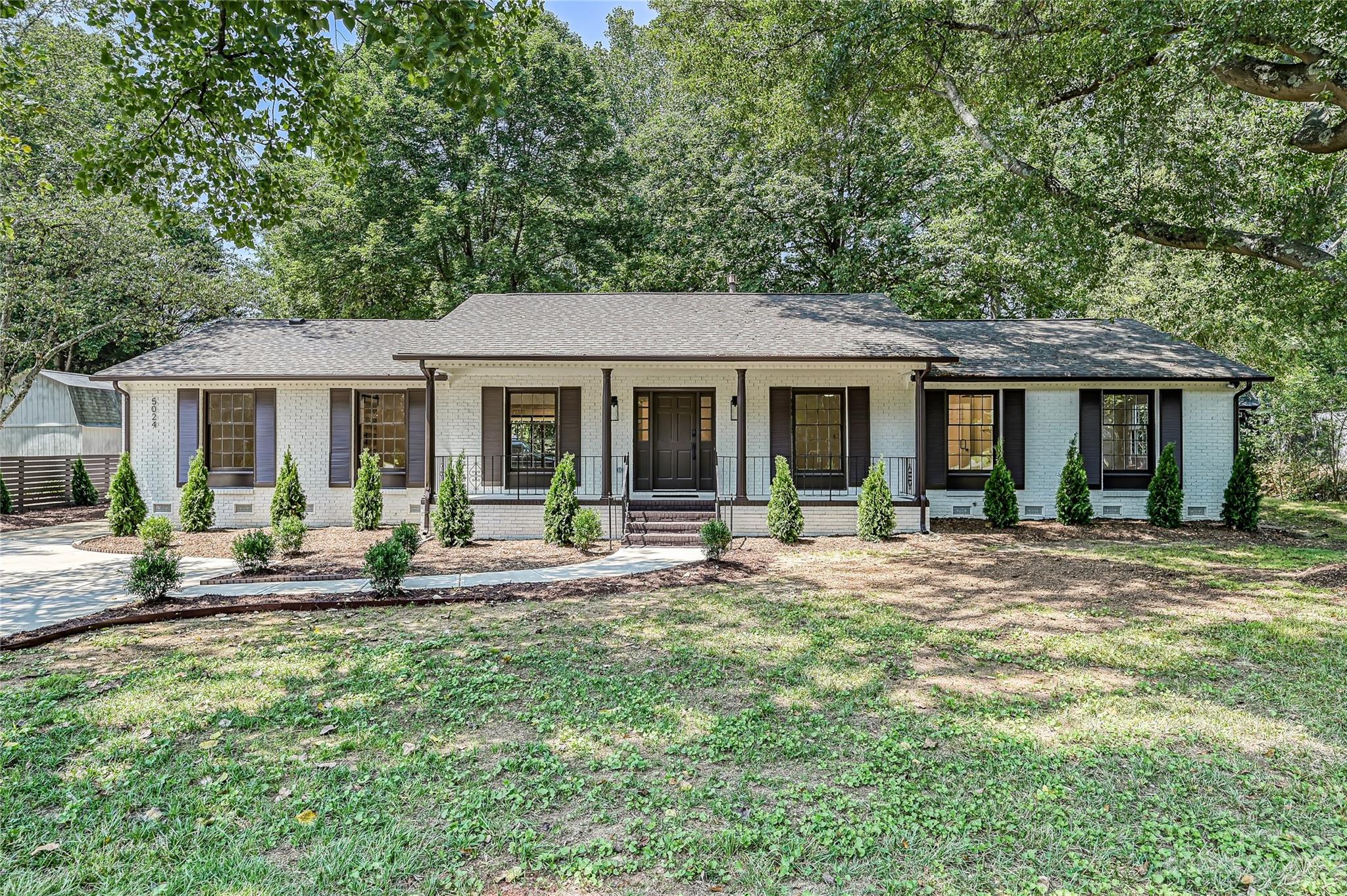 5024 Providence Road Charlotte, NC 28226 - Photo 1 of 39 front view of a house with a patio