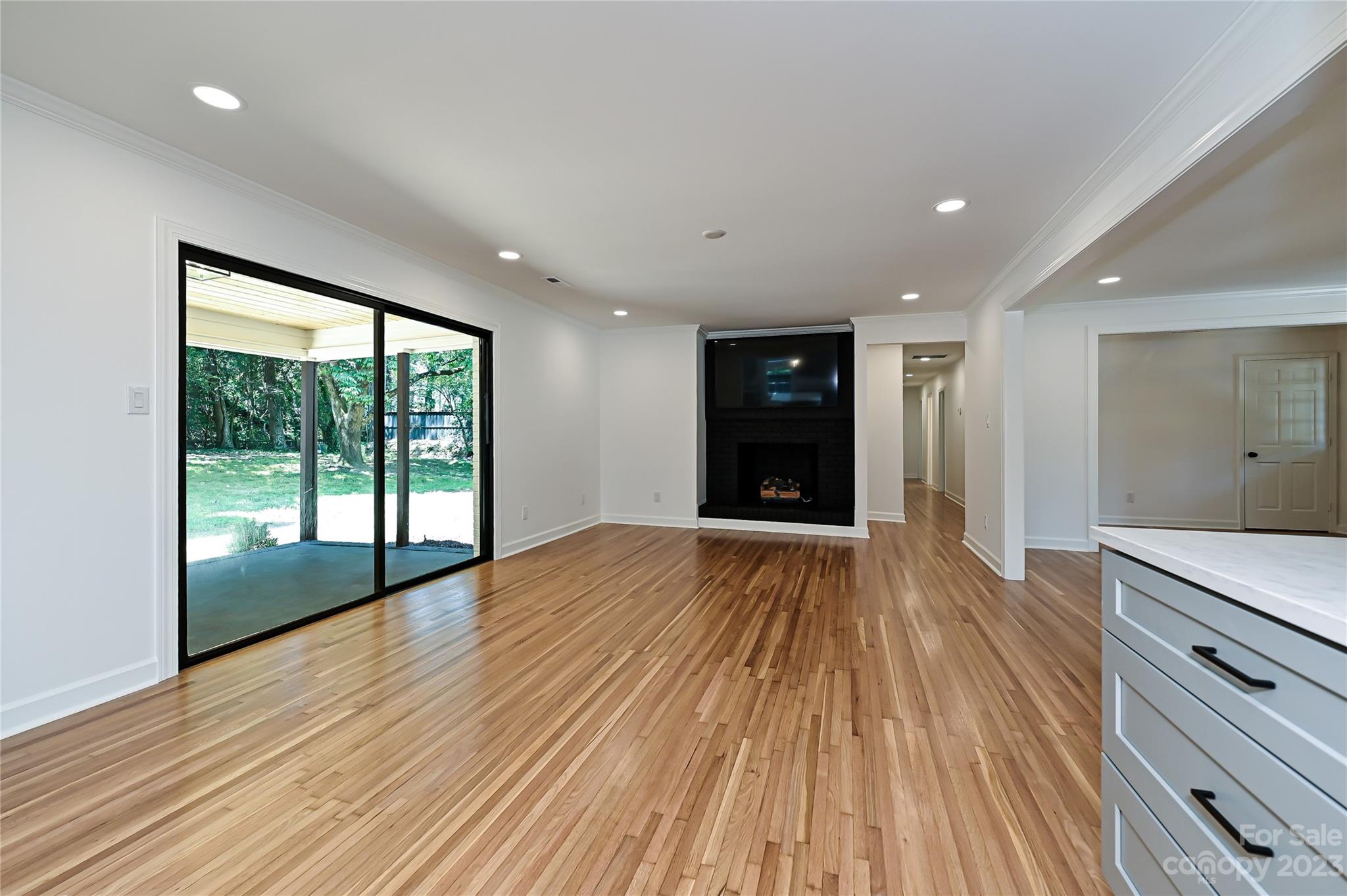 5024 Providence Road Charlotte, NC 28226 - Photo 11 of 39 a view of an empty room with wooden floor and a window