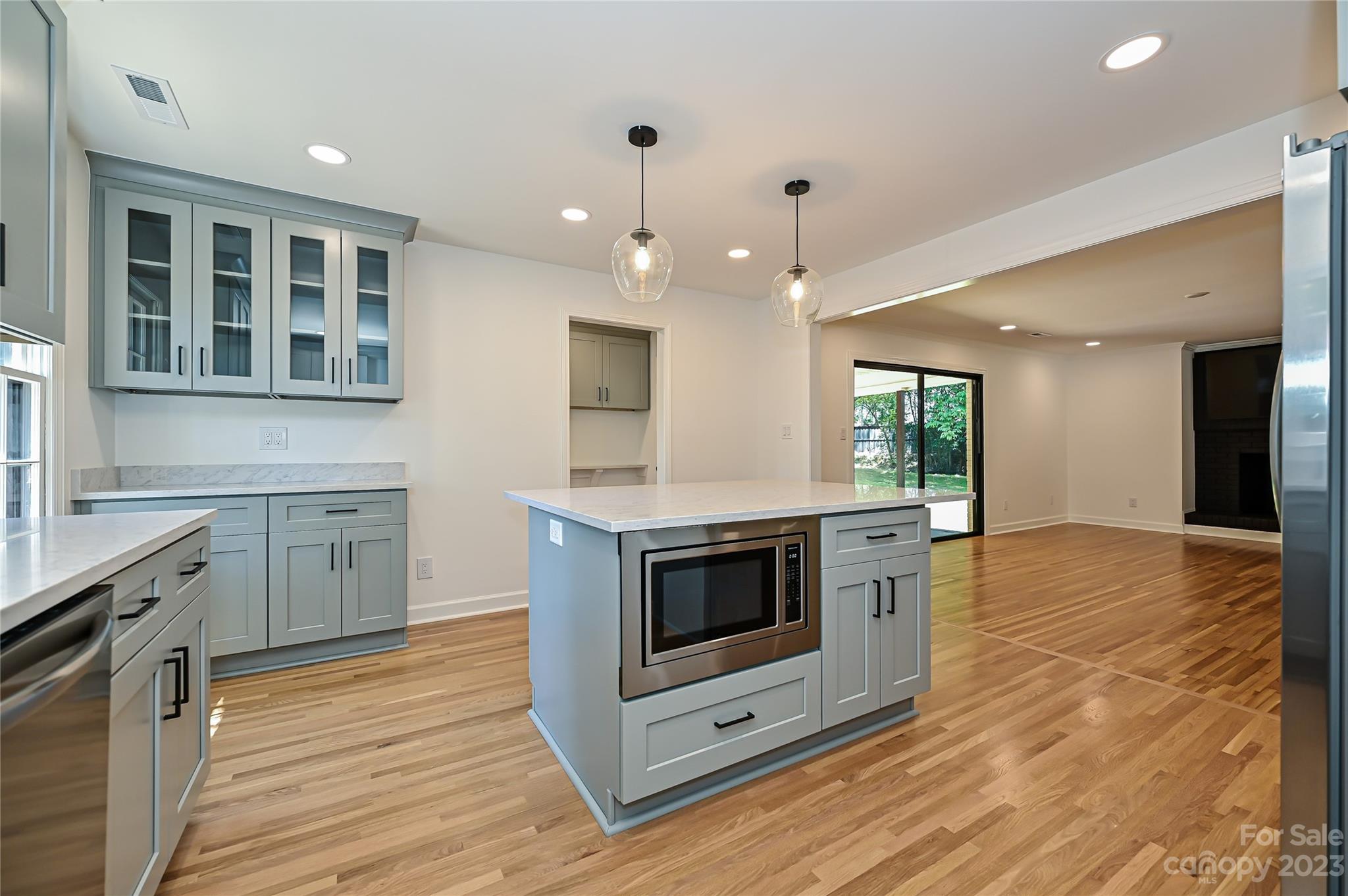 5024 Providence Road Charlotte, NC 28226 - Photo 18 of 39 a kitchen with stainless steel appliances granite countertop a stove a sink and a microwave