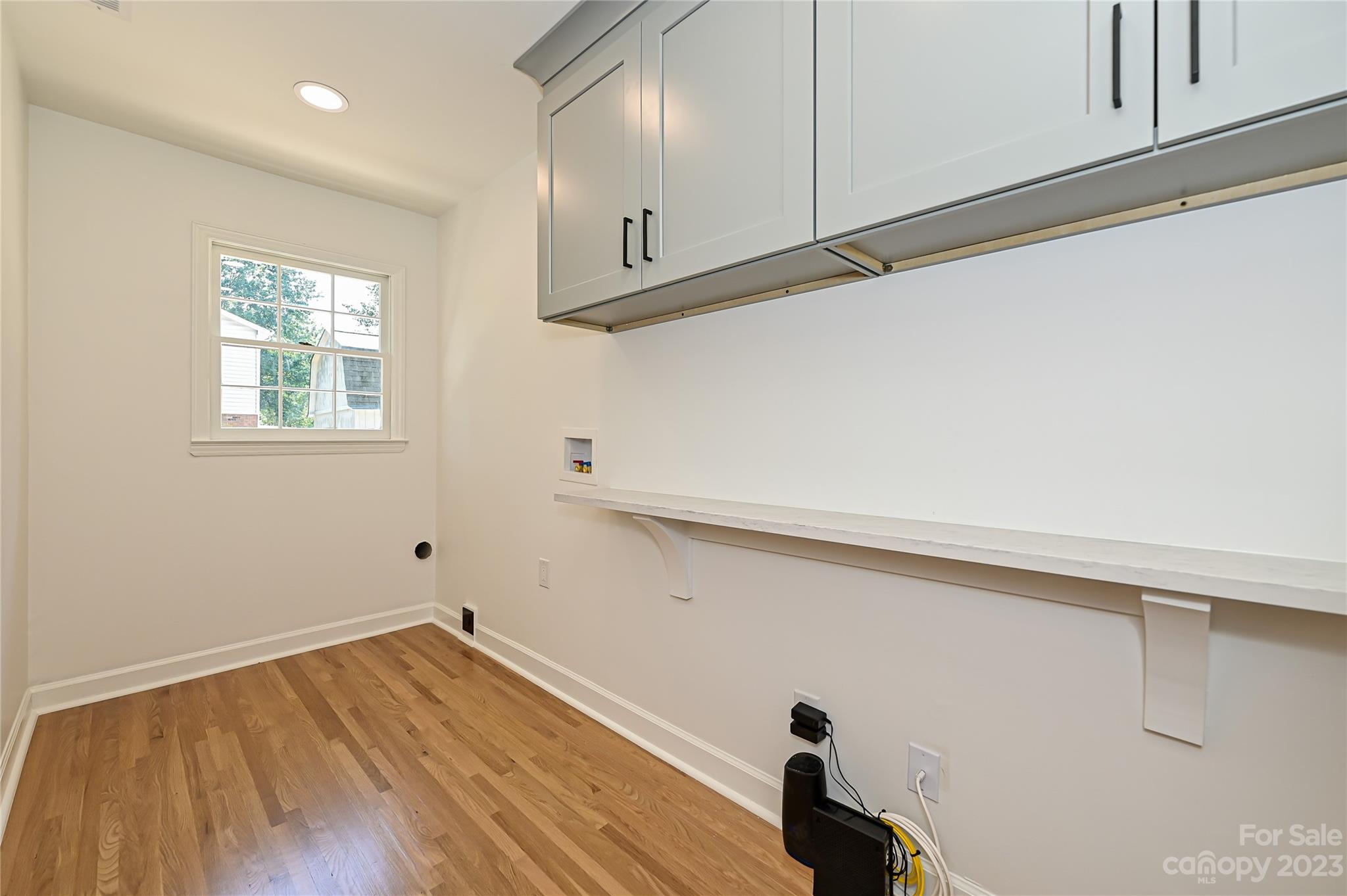 5024 Providence Road Charlotte, NC 28226 - Photo 20 of 39 a view of a room with wooden floor and cabinets