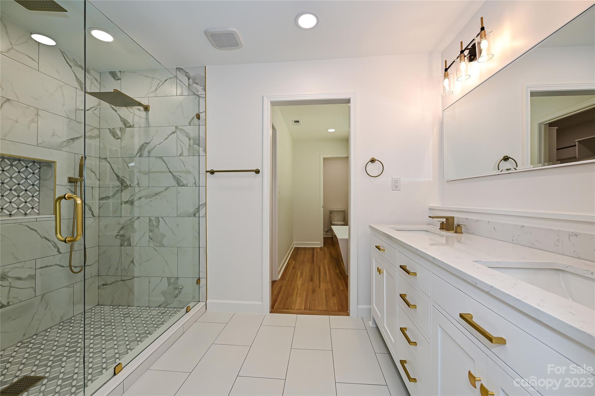5024 Providence Road Charlotte, NC 28226 - Photo 23 of 39 a bathroom with a sink a toilet and shower