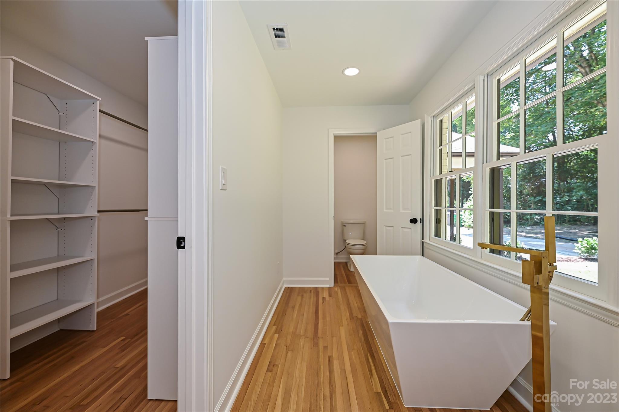 5024 Providence Road Charlotte, NC 28226 - Photo 26 of 39 a spacious bathroom with a bathtub and window