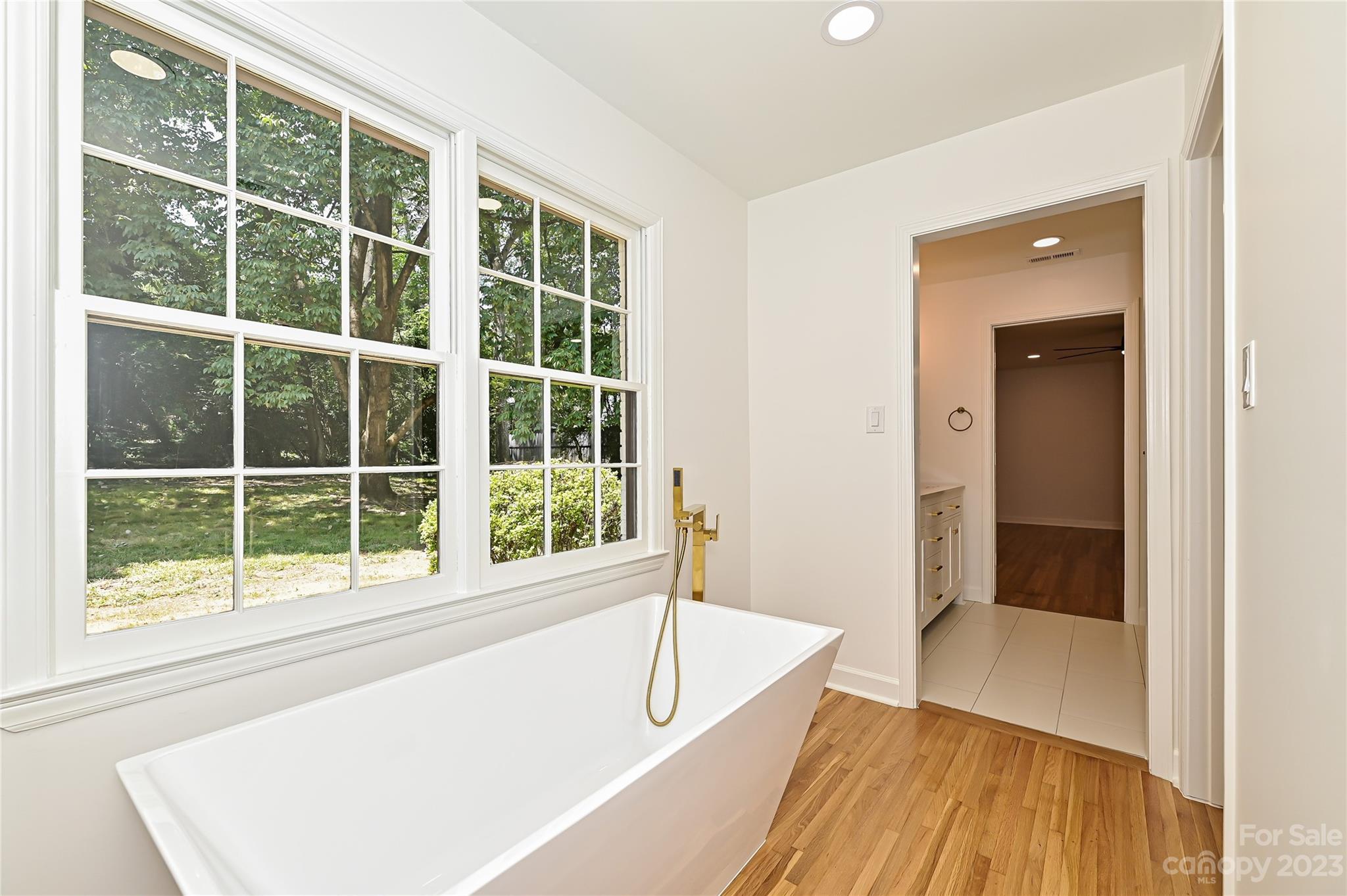 5024 Providence Road Charlotte, NC 28226 - Photo 28 of 39 a view of an empty room with window and wooden floor