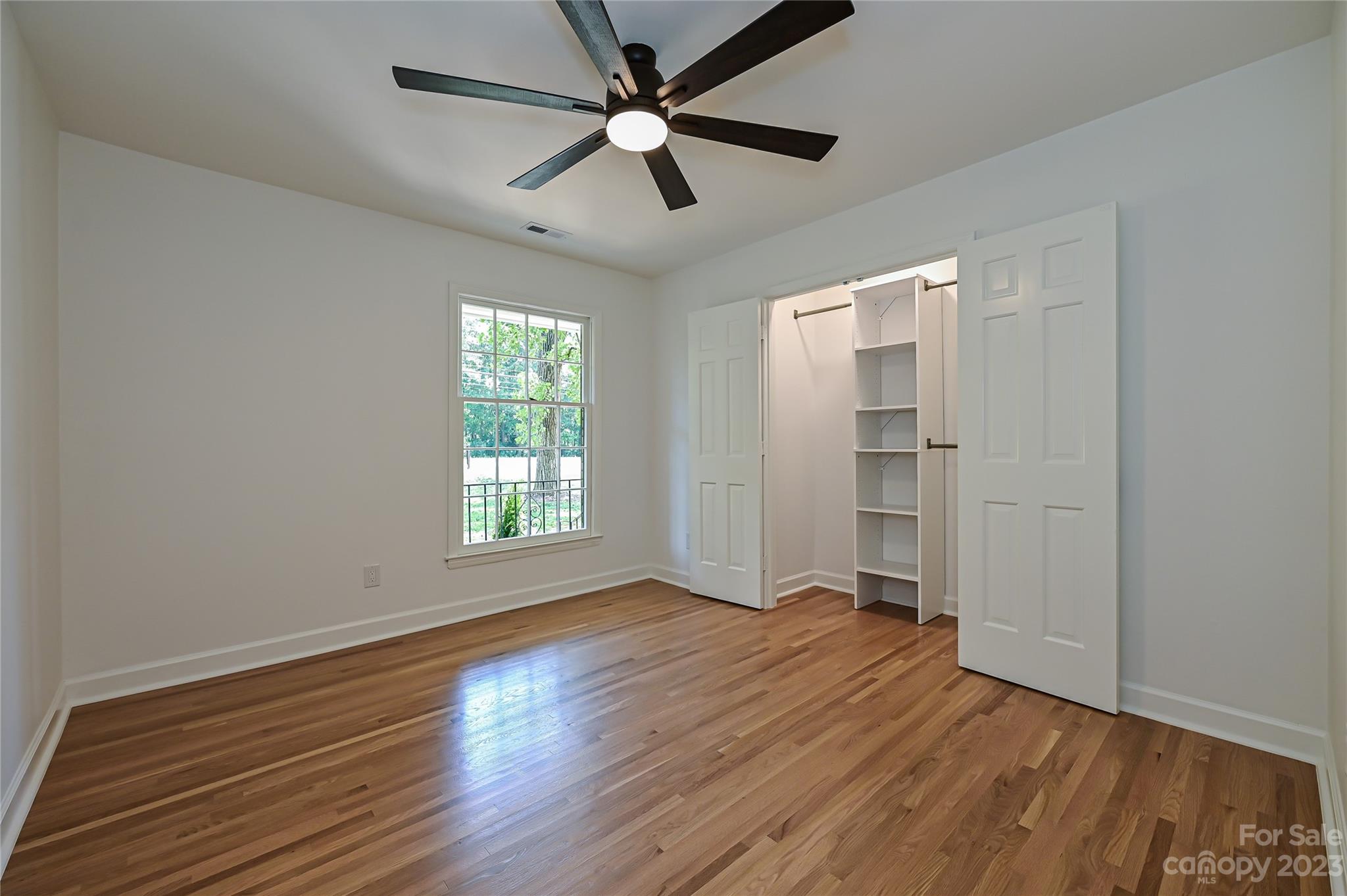 5024 Providence Road Charlotte, NC 28226 - Photo 30 of 39 wooden floor in an empty room with a window