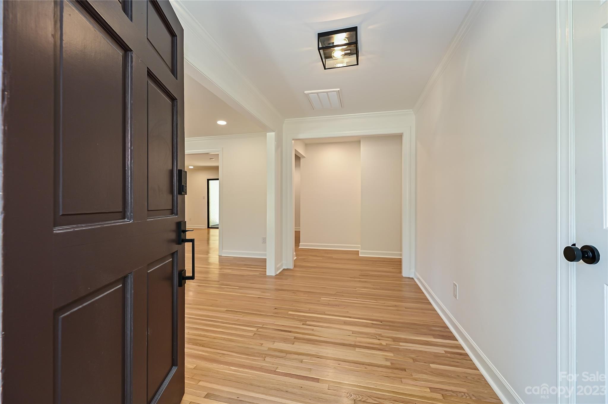 5024 Providence Road Charlotte, NC 28226 - Photo 3 of 39 a view of a hallway with wooden floor