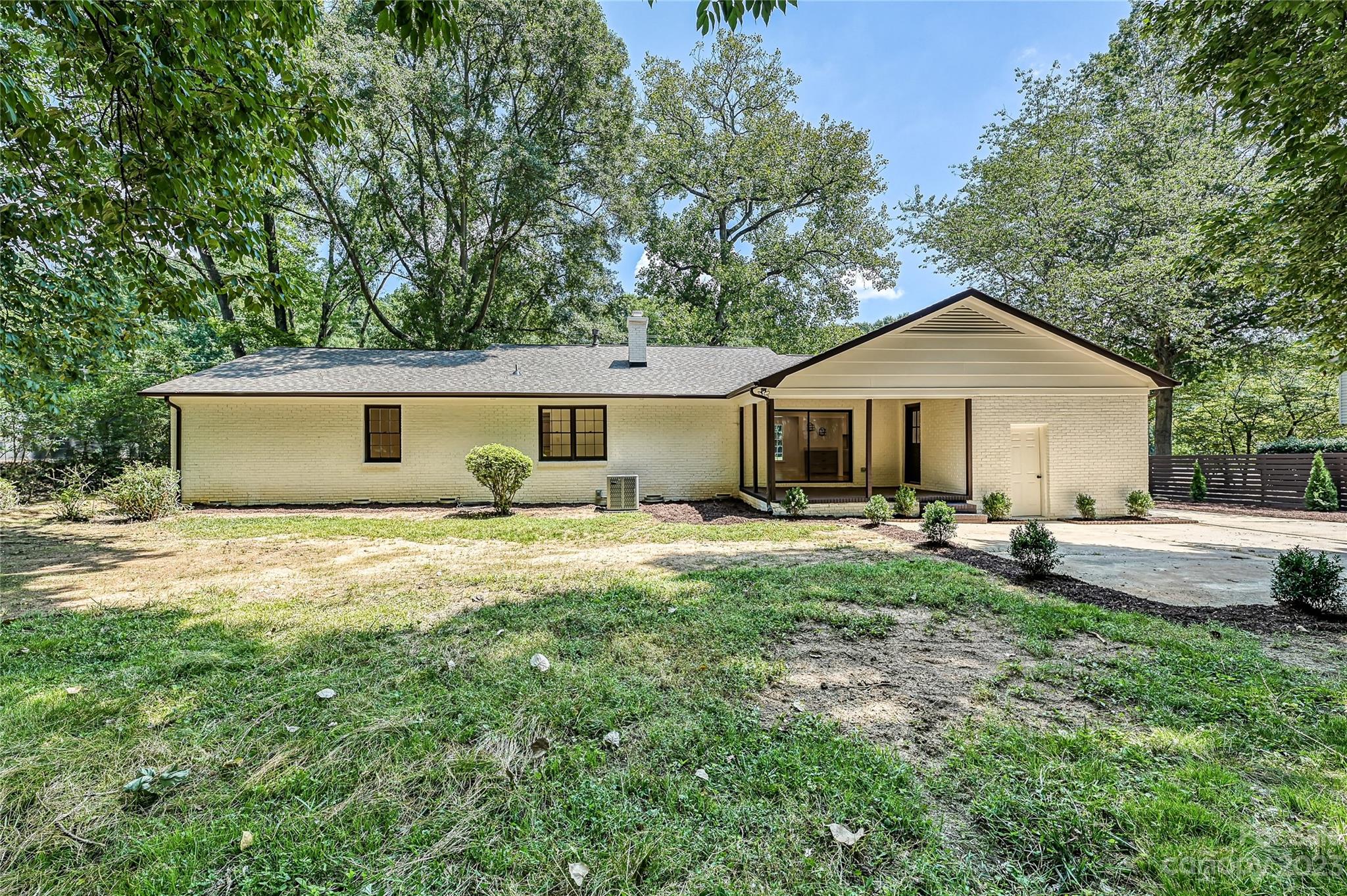 5024 Providence Road Charlotte, NC 28226 - Photo 37 of 39 a front view of a house with yard and green space