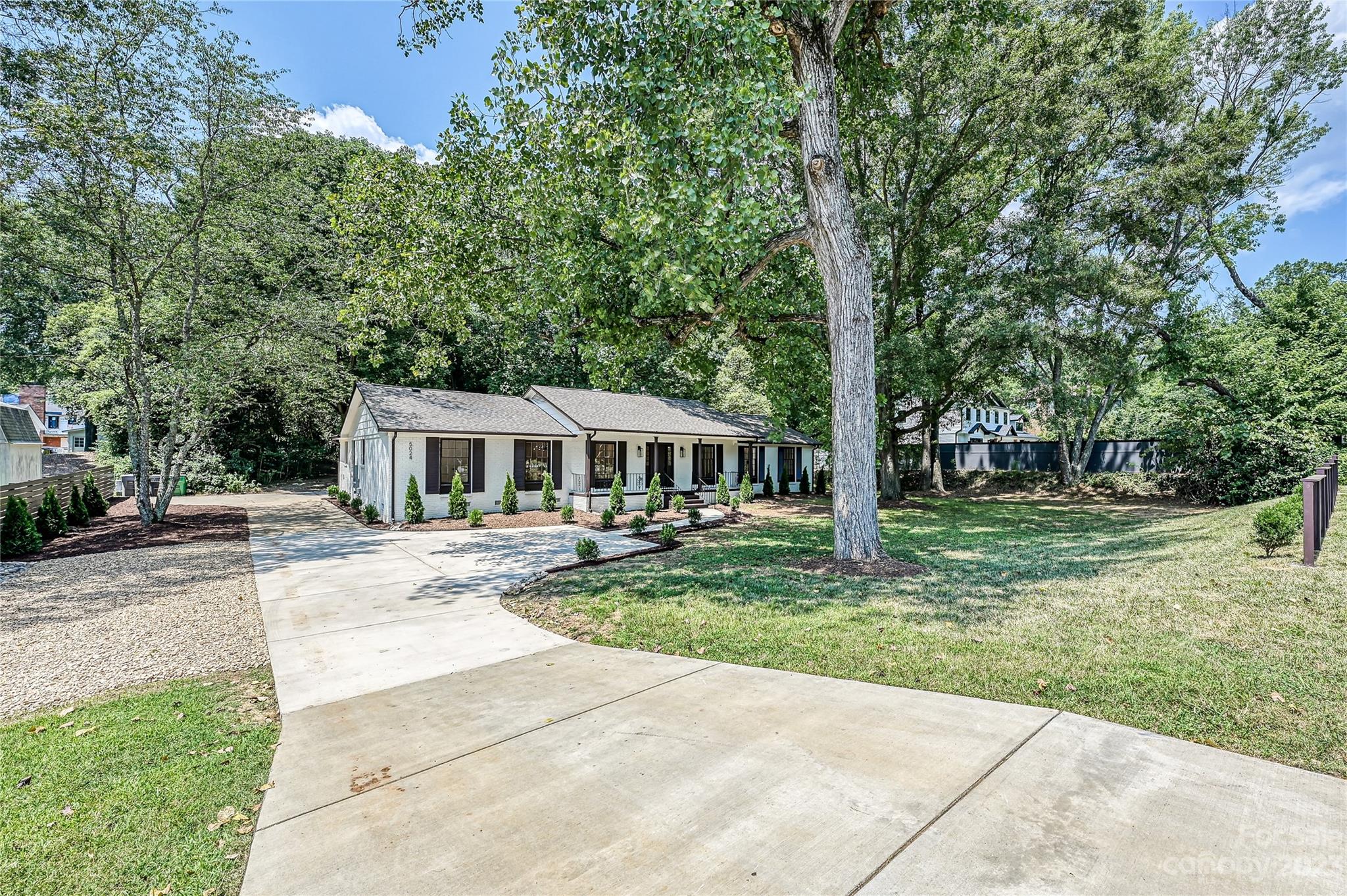 5024 Providence Road Charlotte, NC 28226 - Photo 38 of 39 a view of a house with backyard and sitting area