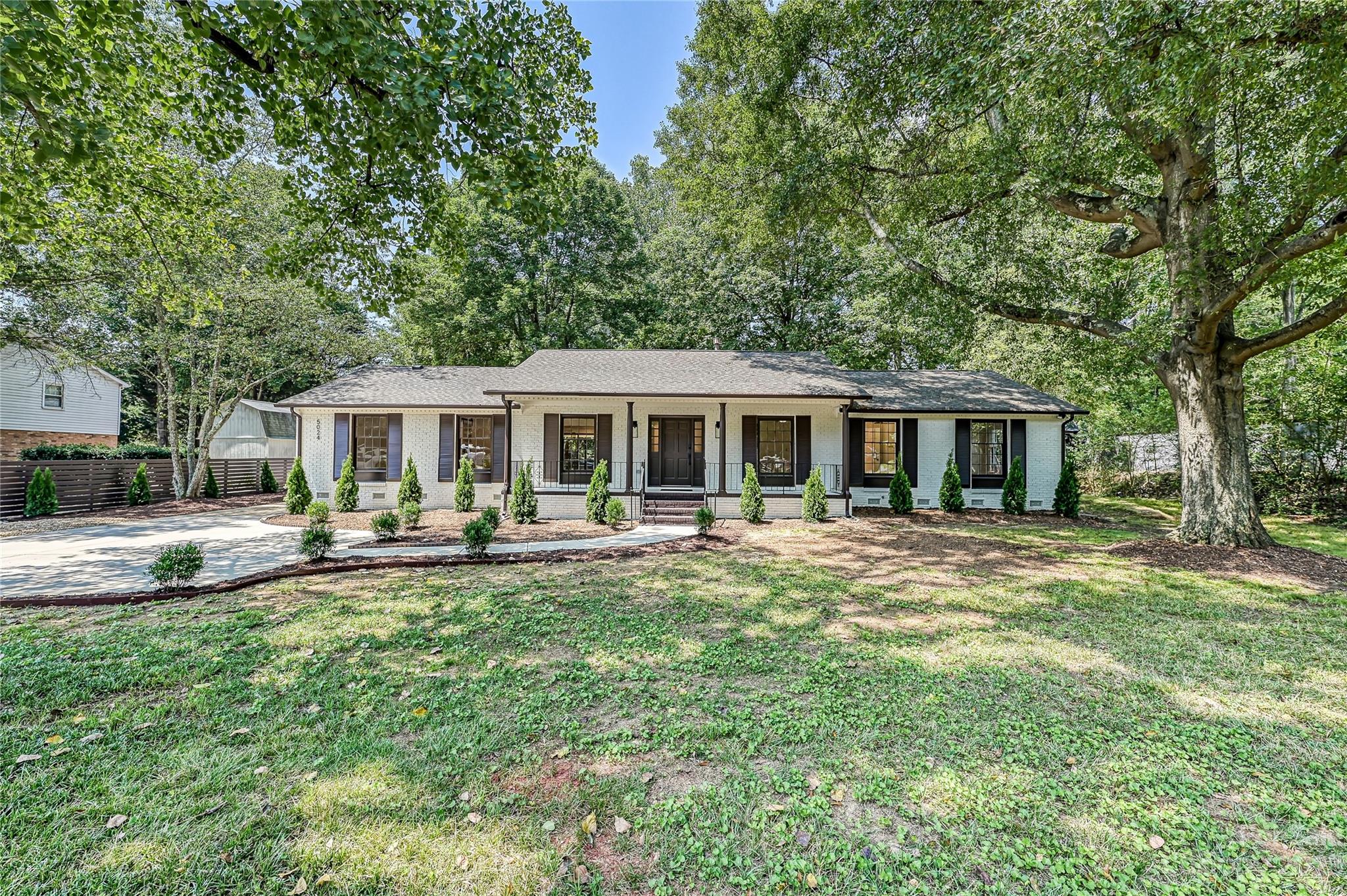 5024 Providence Road Charlotte, NC 28226 - Photo 39 of 39 a front view of a house with swimming pool having outdoor seating