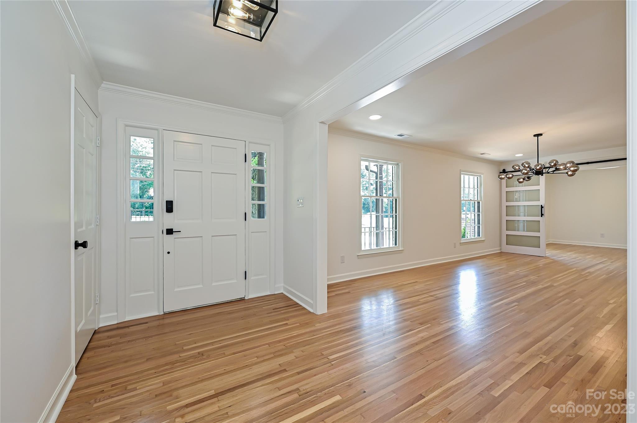 5024 Providence Road Charlotte, NC 28226 - Photo 4 of 39 wooden floor in an empty room with a window