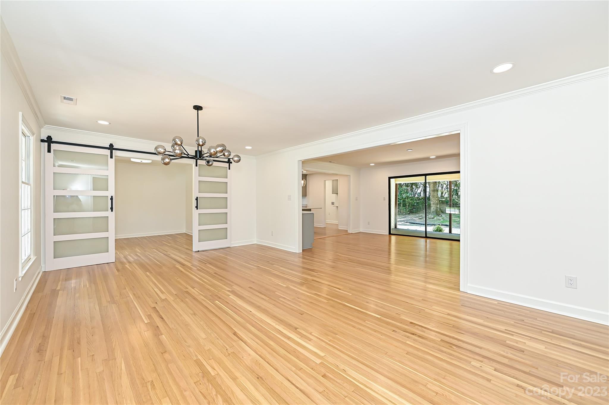 5024 Providence Road Charlotte, NC 28226 - Photo 6 of 39 a view of empty room with wooden floor and window