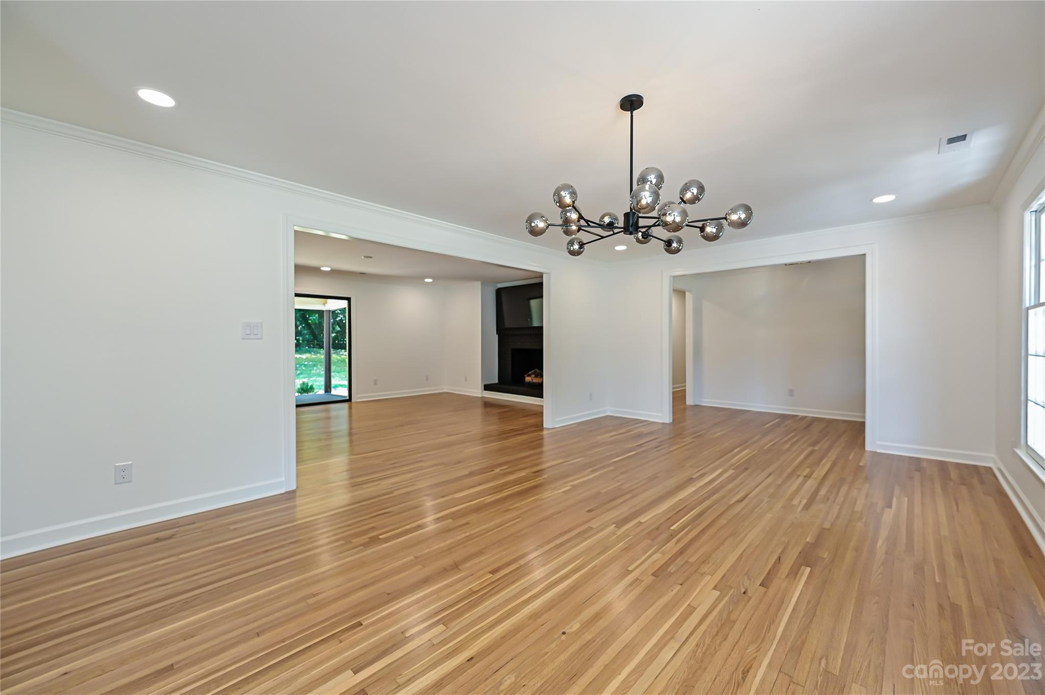 5024 Providence Road Charlotte, NC 28226 - Photo 10 of 39 a view of a room with wooden floor and staircase