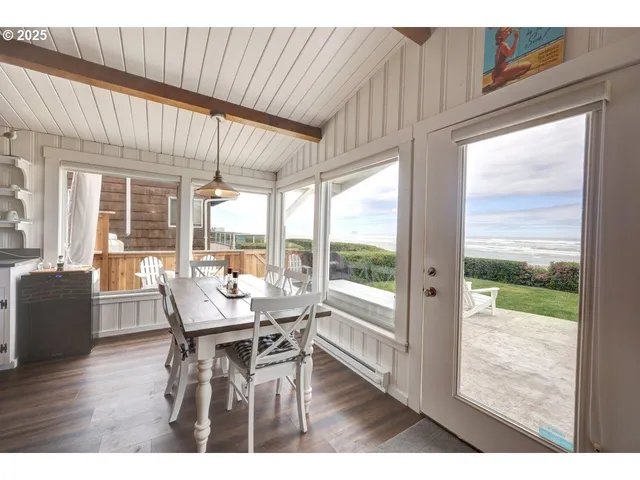 a dining room with furniture and wooden floor