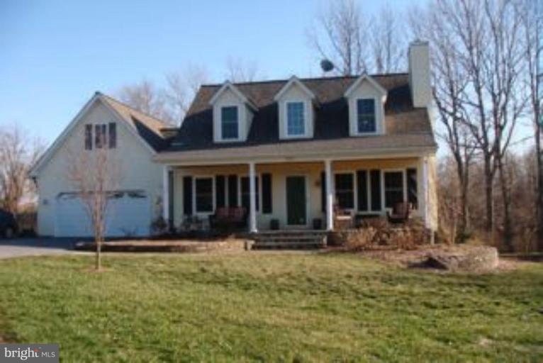 285 West Bay Front Road Lothian, MD 20711 - Photo 3 of 26 a front view of a house with garden