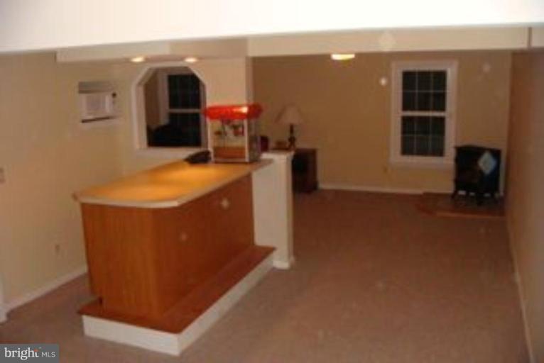 285 West Bay Front Road Lothian, MD 20711 - Photo 22 of 26 a living room with furniture and a fireplace