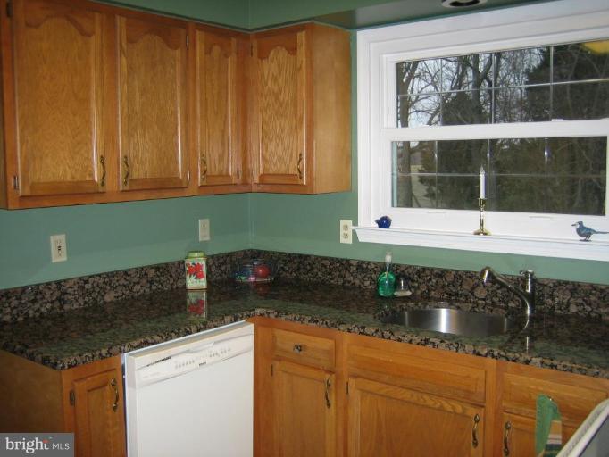 285 West Bay Front Road Lothian, MD 20711 - Photo 4 of 26 a kitchen with a sink and a window
