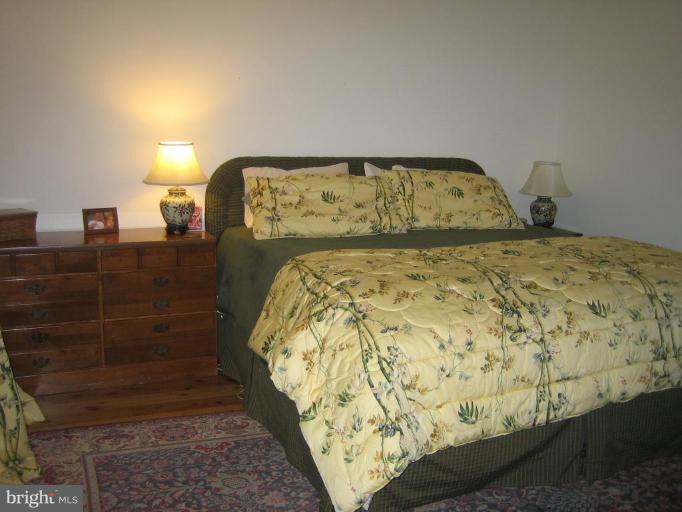285 West Bay Front Road Lothian, MD 20711 - Photo 5 of 26 a bedroom with a bed and a window