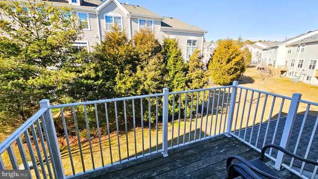 a view of a balcony with wooden fence