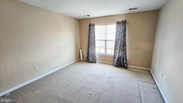 a view of empty room with front door