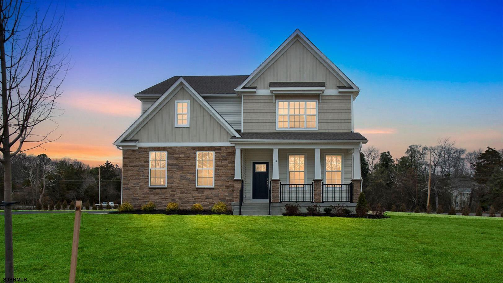 13 Henry Road Marmora, NJ 08223 - Photo 1 of 19 a front view of a house with a garden