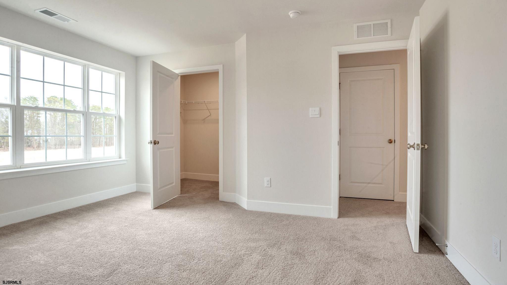 13 Henry Road Marmora, NJ 08223 - Photo 15 of 19 an empty room with windows and closet