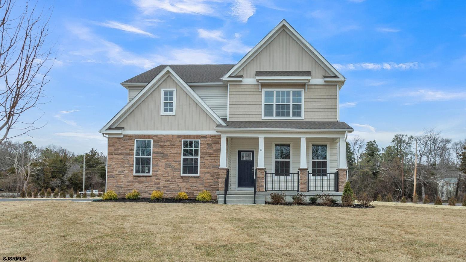 13 Henry Road Marmora, NJ 08223 - Photo 3 of 19 a front view of a house with a yard