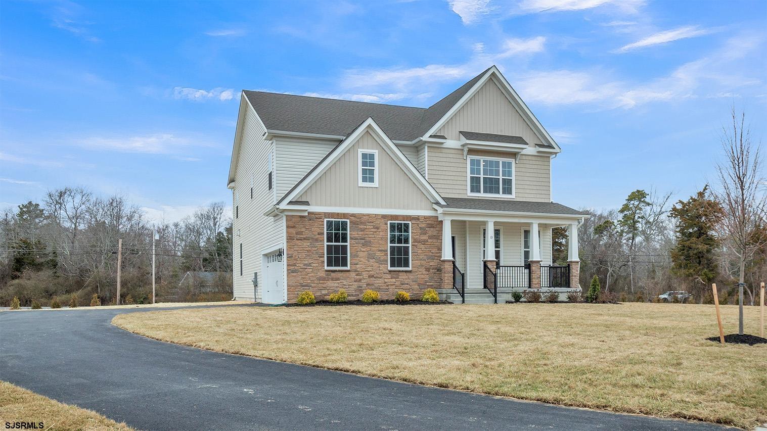 13 Henry Road Marmora, NJ 08223 - Photo 4 of 19 a front view of a house with a yard