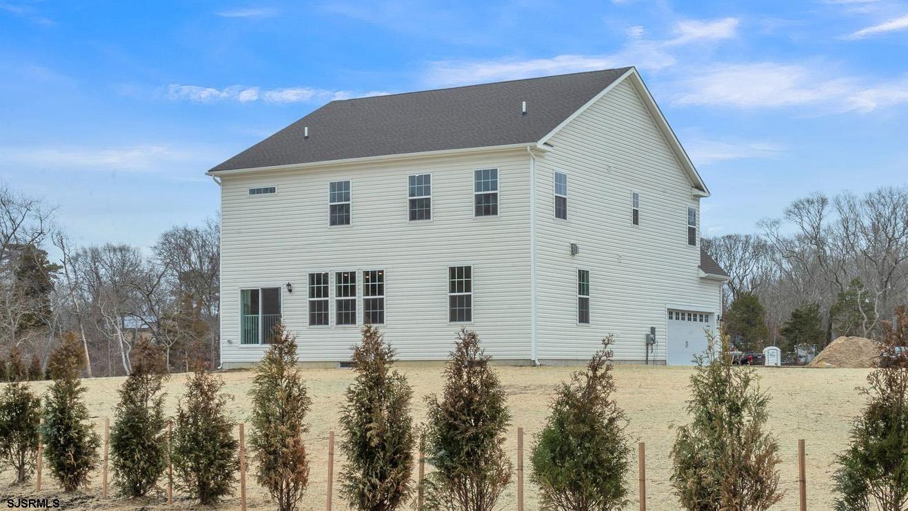 13 Henry Road Marmora, NJ 08223 - Photo 5 of 19 a view of a house with a yard
