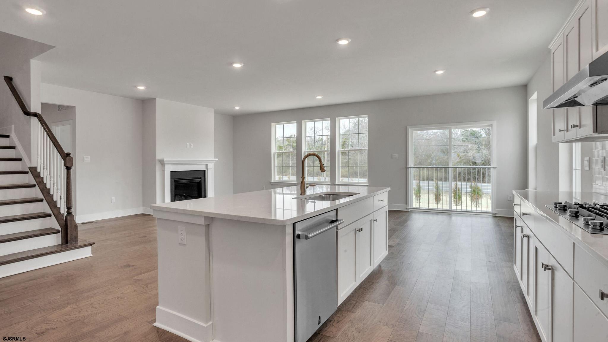 13 Henry Road Marmora, NJ 08223 - Photo 6 of 19 a kitchen with stainless steel appliances granite countertop a stove and a sink