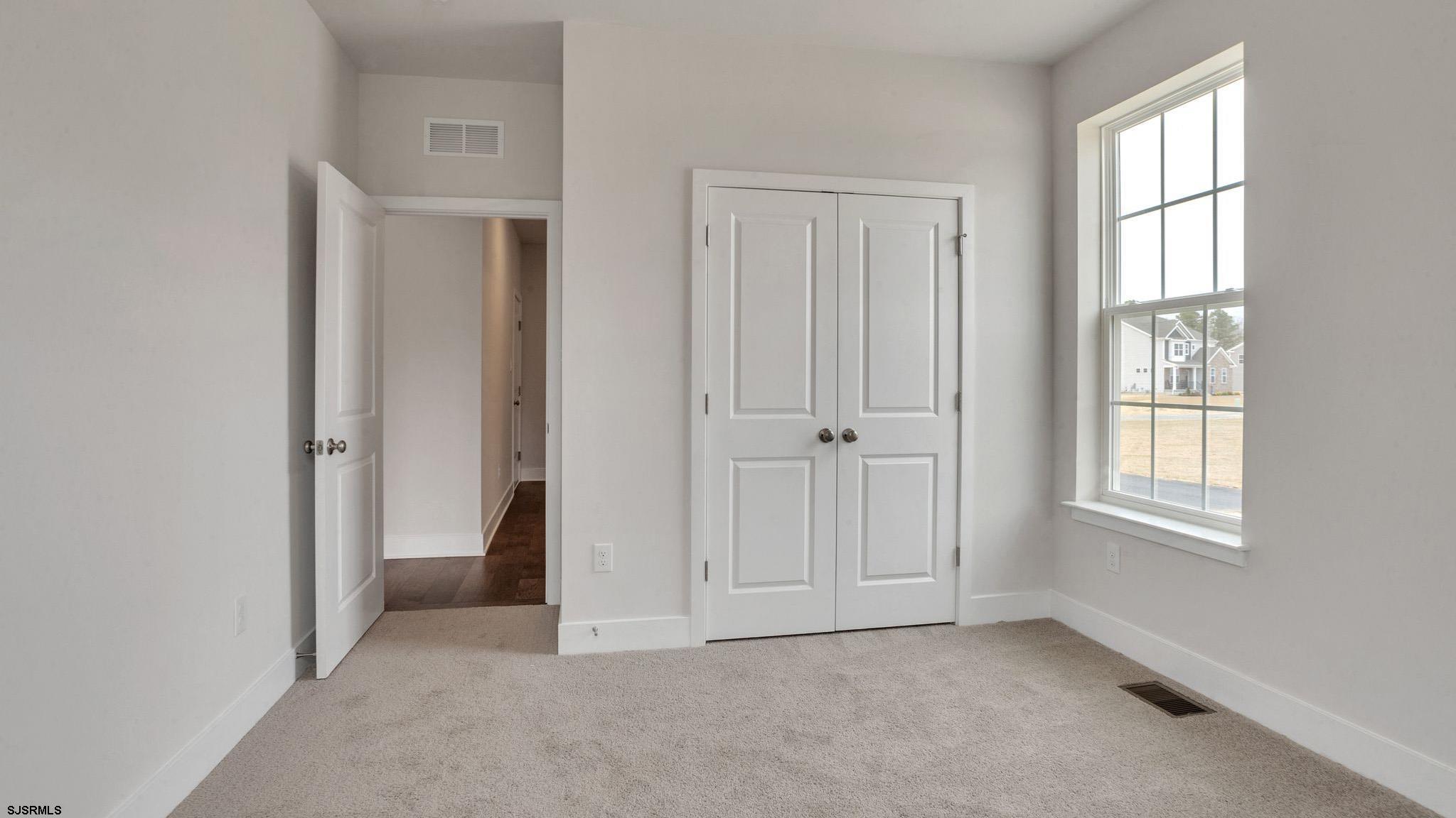 13 Henry Road Marmora, NJ 08223 - Photo 10 of 19 an empty room with windows and closet