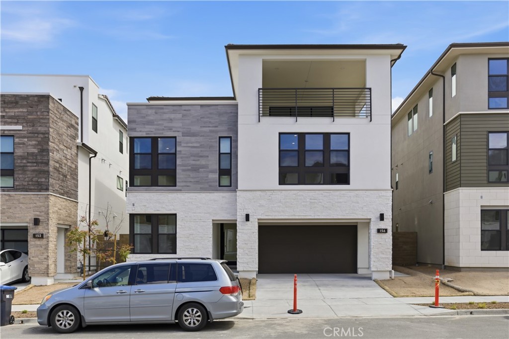156 Apron Irvine, CA 92618 - Photo 2 of 40 a car parked in front of a building