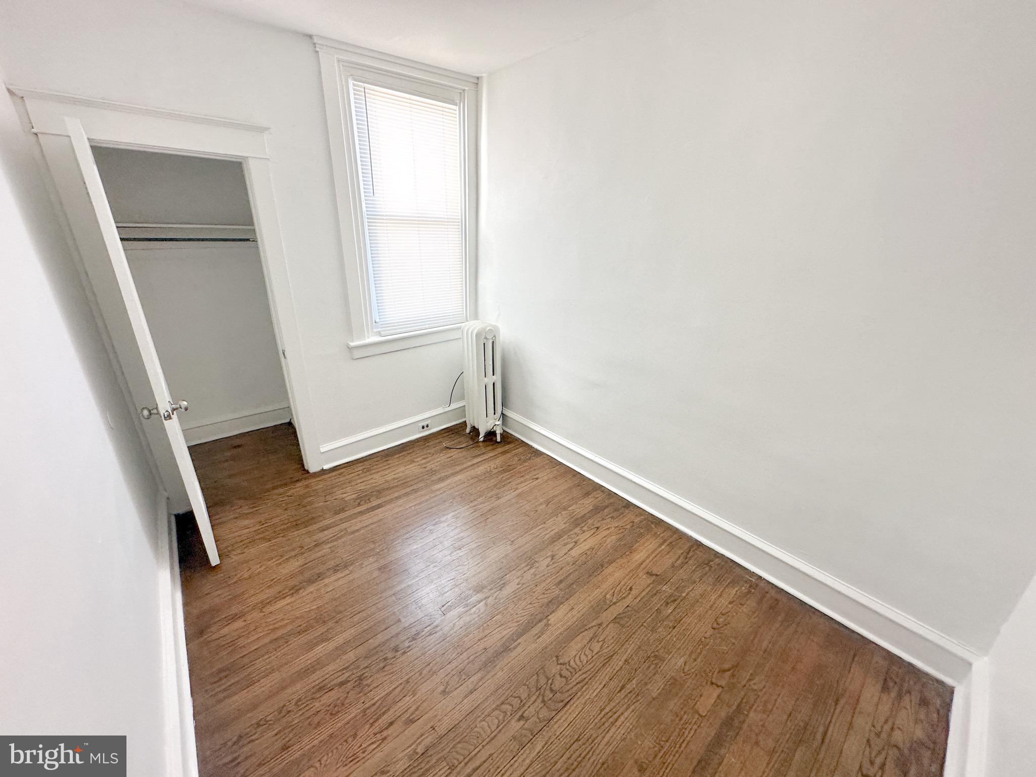 4507 North Reese Street Philadelphia, PA 19140 - Photo 14 of 23 an empty room with wooden floor and window